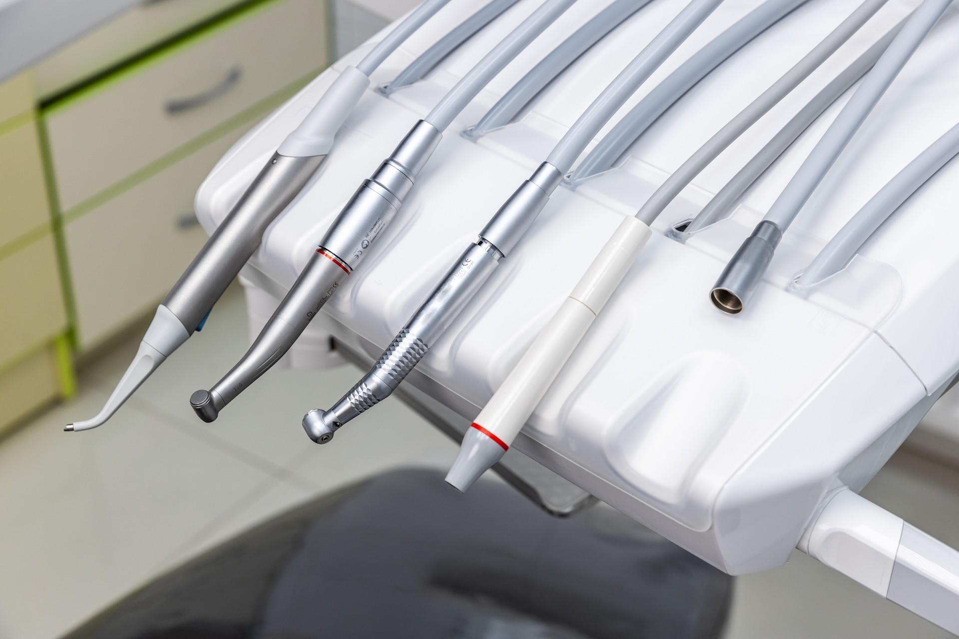 An Array of Dental Instruments Displayed on a Modern Chair, Showcasing Essential Tools for Oral Care and Professional Dentistry Procedures in a Well-Equipped Dental Office